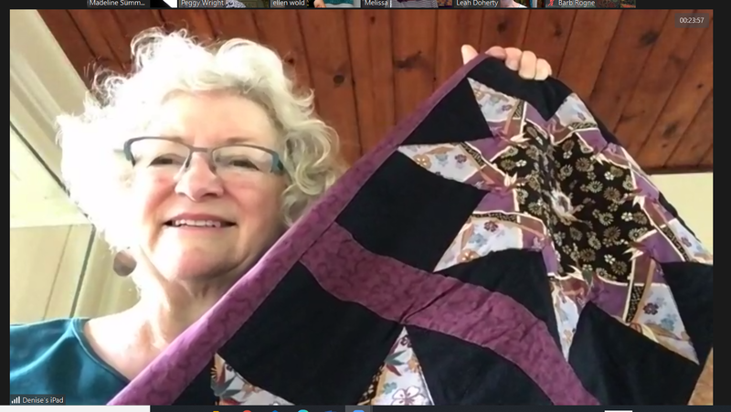 quilter with a quilt