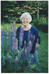 Rev. Karen Gustafson with purple flowers